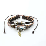 FASHIONA - Heren brede armband. Boho en hippie stijl met evil eye, uil en veer. Geïnspireerd op de jaren '60 en '70. Gemaakt van kralen, metaal, touw en leer. 4