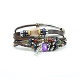 Heren brede armband. Boho en hippie stijl met detail van een vis. Geïnspireerd op de jaren '60 en '70. Gemaakt van kralen, metaal, touw en leer.2