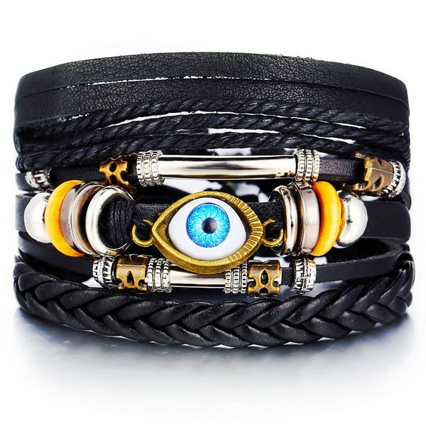 Heren brede armband. Boho en hippie stijl met detail van een evil eye. Geïnspireerd op de jaren '60 en '70. Gemaakt van kralen, metaal, touw en leer.