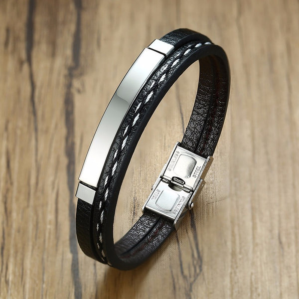 Heren armband clean design met zwart leer, roestvrij staal en zilverkleurig accent. Fashion, mode