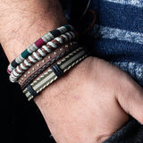 Brede heren armband bestaande uit 4 delen. Gemaakt van metaal, touw en leer.