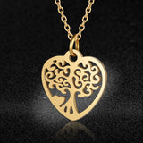 Damesketting van roestvrij staal. Tree of life in hartje, goudkleurig. Mode, fashion, accessoires.